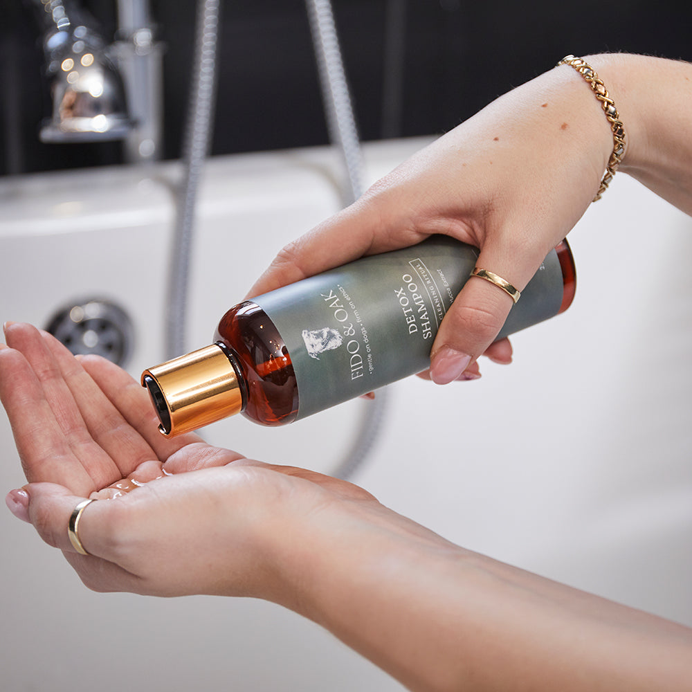 Fido & Oak detox dog shampoo being poured into hands